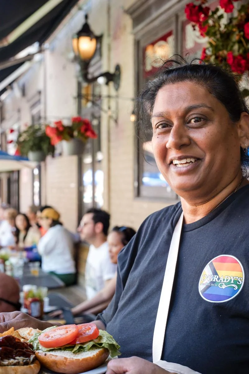 Person serving food on the O’Grady’s patio
